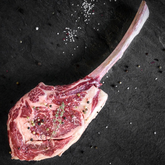 A raw meat with spices on a black surface

AI-generated content may be incorrect.