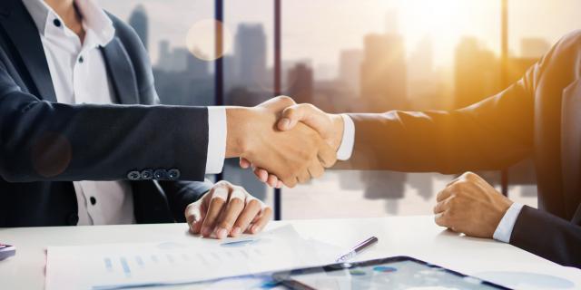 sucessful cooperation and confident partner concept, business people shake hands with customer