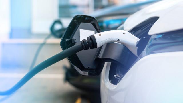 An electric car being charged at a charging station
